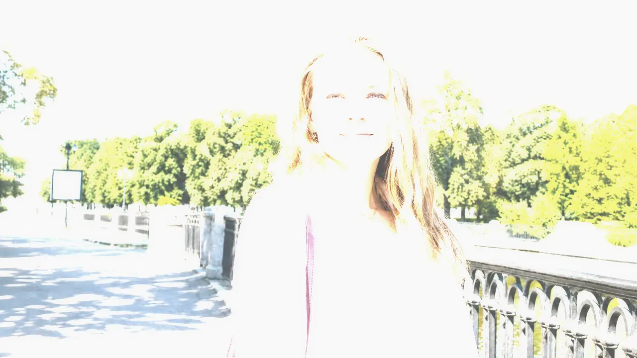 Overexposed portrait photo of a woman before AI highlight and skin tone repair